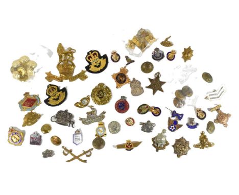 A large collection of assorted Military cap badges to include; Royal Marines Pouch badge, silver hallmarked ARP badge, Kings 
