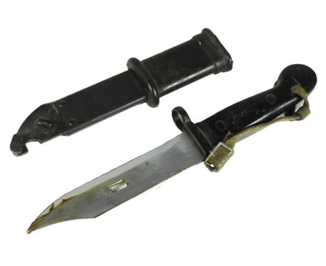 A vintage East German Model 59 Type I AKM Kalashnikov rifle bayonet. The bayonet having a serrated edge to the back of the bl