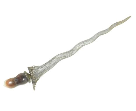 An early 20th Century Malayan Kris / Keris dagger. Hooked carved wooden grip with a typical wavy blade. Measures approx 41cm.