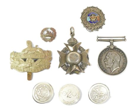 A collection of assorted medals and badges to include; WWI First World War medal awarded to one 289328 S.H Mayo Chief Petty O