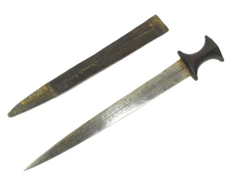 An early 20th Century Sudanese / Omdurman dagger. Waisted wooden grip with flat pommel and a tapering blade etched with scrol