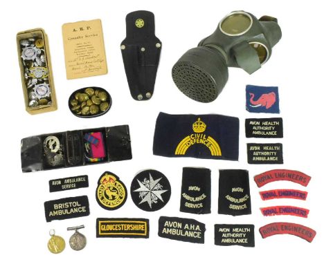 A collection of assorted First and Second World War militara to include; WWI medal pair awarded to one 28148 Pte A J Herbert 