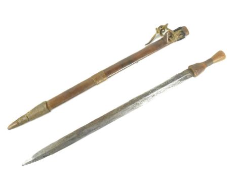 A Southern African Zimbabwe Shona People Bakatwa dagger. Fluted hardwood grip with fine wire banding and a long stiletto blad