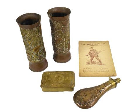 A collection of assorted World War militaria comprising; WWI First World War Princess Mary Christmas tin, x2 trench art artil