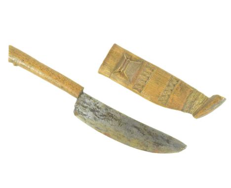 An early 20th Century Southern African (Zimbabwe) Shona dagger housed in a carved scabbard with a central attachment loop for