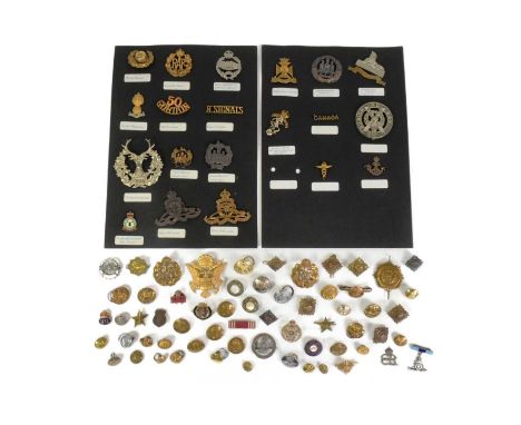 A collection of First and Second World War military cap badges and uniform buttons to include; The Wiltshire Regiment, RAF Ro