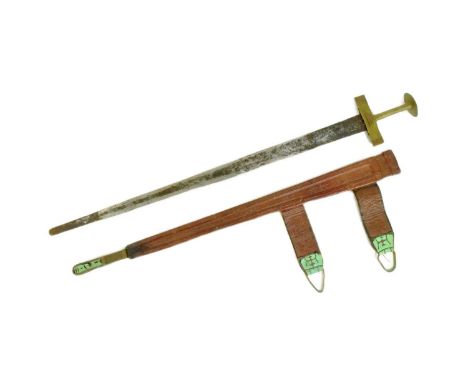 A mid 20th Century North African Tuareg / Hausa people Takouba tribal sword. Flat dome shaped pommel, chiselled brass hilt an