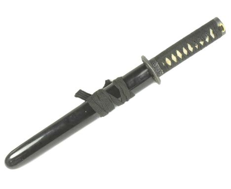 A vintage Japanese Tanto knife dagger. Pebbled grip bound with black rope and a pierced tsuba in the form of a mythical drago
