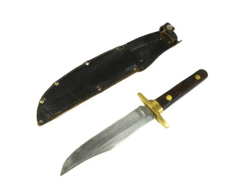A vintage fixed blade bowie knife. Redwood grip with finger grooves, exposed tang and brass crossguard. Clipped blade housed 