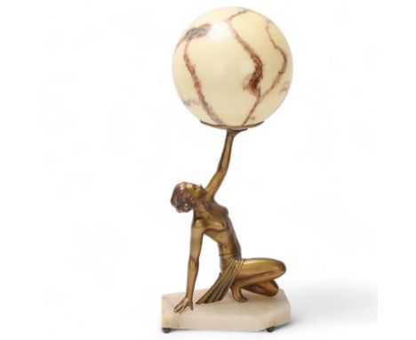 Art Deco gilded spelter and alabaster table lamp, the ball-shaped coloured glass shade supported by a naked dancer figure on 