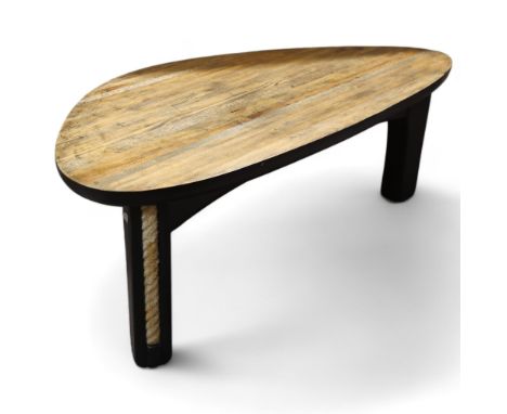 TERRY WARREN, an ebonised driftwood coffee table, with polished top and rope inserts to legs, signed under top with hand prin