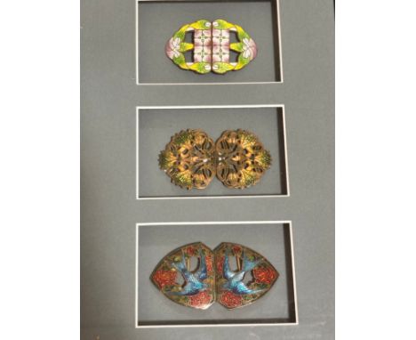 3 Art Nouveau coloured enamel buckles, mounted in good quality modern frame, overall frame dimensions 32cm x 23cmGood conditi