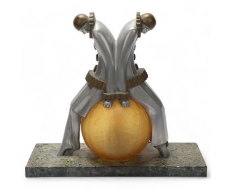 Art Deco aluminium and brass Pierrot clown design table lamp, with amber glass ball shade and marble base, height 28cm, base 