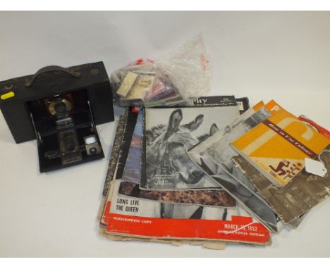 A VINTAGE BOX CAMERA TOGETHER WITH A QUANTITY OF COLLECTABLE MAGAZINES, MATCH BOOKS ETC