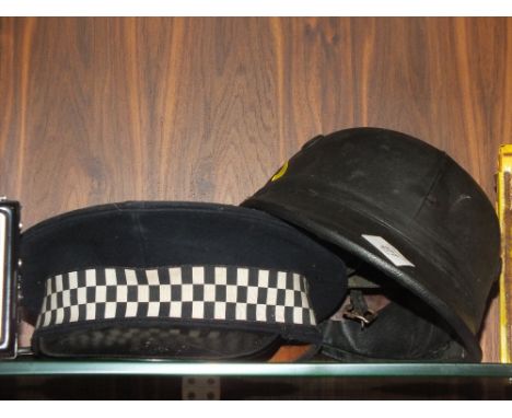 A VINTAGE POLICE OFFICERS CAP TOGETHER WITH A VINTAGE LEATHER HELMET