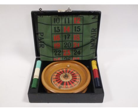 A VINTAGE CASED ROULETTE SET