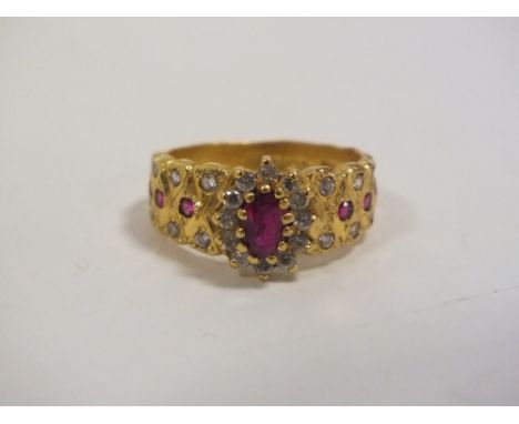 A 916 GOLD RUBY GEM SET RING