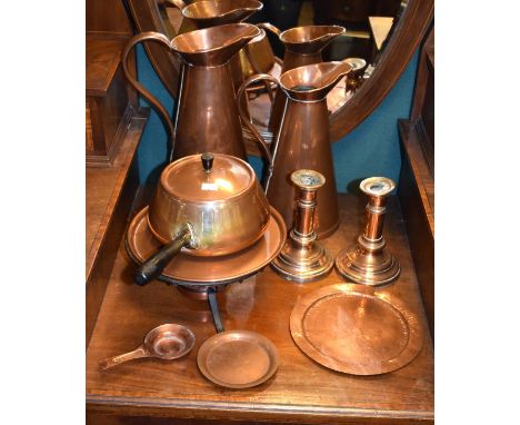 Two graduated copper jugs, small quantity of other copper (one shelf)   Condition: 