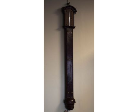 Antique mahogany stick barometer having an engraved brass dial, the reservoir with wrythened carving   Condition: 