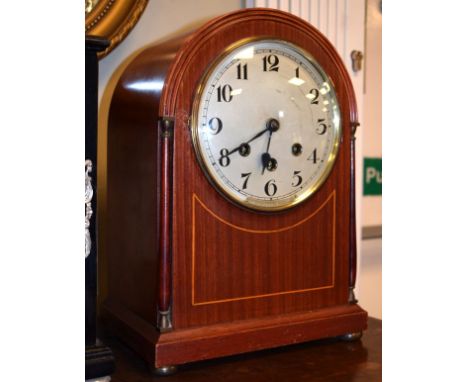 Early 20th Century mahogany and string inlaid arch top mantel clock having striking and chiming movement   Condition: 