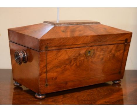 19th Century brass inlaid mahogany sarcophagus shaped tea caddy standing on bun feet   Condition: 