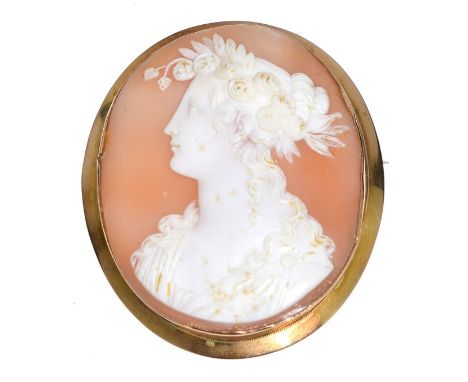 Late 19th/early 20th Century oval portrait cameo brooch depicting a classical female with roses in her hair, the mount stampe