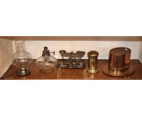 Brass and copper top hat, postage scales, money box and an oil lamp   Condition: 