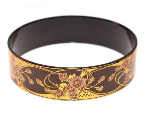 Michaela Frey burgundy coloured bangle having gilt decoration of flowers   Condition: 