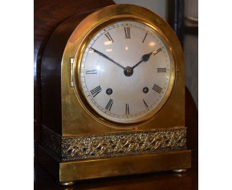 Early 20th Century brass arch cased mantel clock, silvered dial with Roman numerals, foliate frieze below, brass movement str