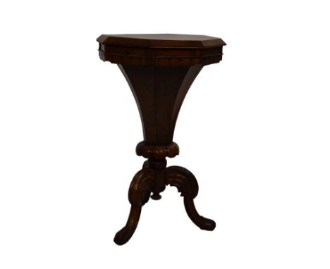 Victorian rosewood and walnut octagonal topped work table, the cover opening to reveal a fitted interior, standing on a turne