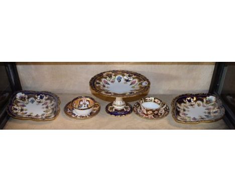Royal Crown Derby comport having heavily gilt highlighted foliate decoration on a cobalt ground, printed marks and date cyphe