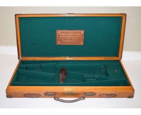 Army and Navy Company oak and leather gun case to house a pair of shotguns, having brass mounts and embossed inscription   Co