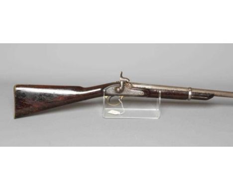 A PERCUSSION CARBINE MUSKET with 31" barrel, action bearing a crown, half length wood stock, brass trigger guard and brass bu