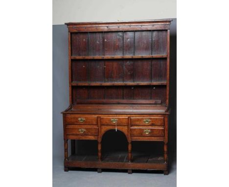A LATE GEORGIAN OAK POT BOARD DRESSER, early 19th century, the boarded delft rack with ogee moulded cornice over three shelve