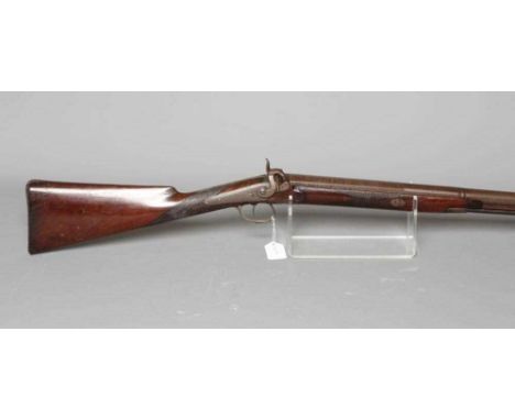 A PERCUSSION MUSKET, 19th century, the 34" damascus barrel octagonal at the breech, foliate scroll etched barrel tang and act