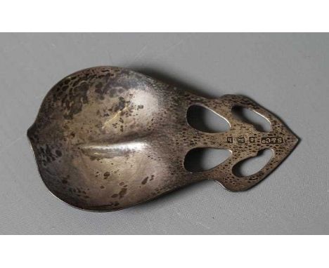 AN EDWARDIAN ARTS AND CRAFTS CADDY SPOON by Sydney &amp; Co., Birmingham 1907, the stylised leaf bowl with pierced and planis