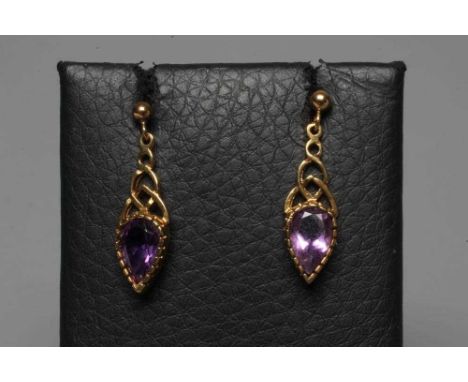 A PAIR OF AMETHYST DROP EARRINGS, the facet tear cut stones collet set and pendant from a graduated open knot on plain 9ct go