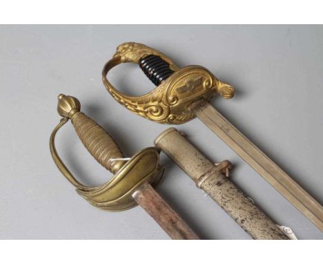 A SPANISH OFFICER'S SWORD by FN, Toledo, the 31" blade bearing maker's mark, brass hilt with chain hand guard and eagle pomme
