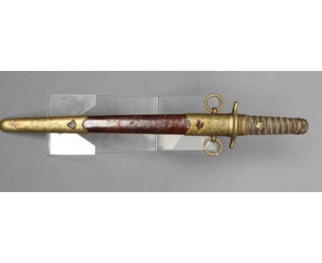 A JAPANESE NAVAL DIRK with 9 3/8" straight blade, serpentine hand guard, shagreen grip with blossom decoration, button releas