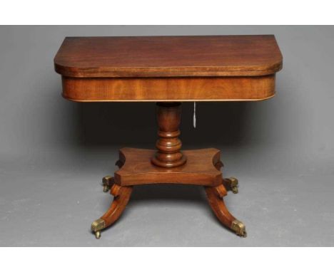 A GEORGIAN MAHOGANY FOLDING TEA TABLE, early 19th century, the rounded swivel top on turned vase stem, the concave platform r