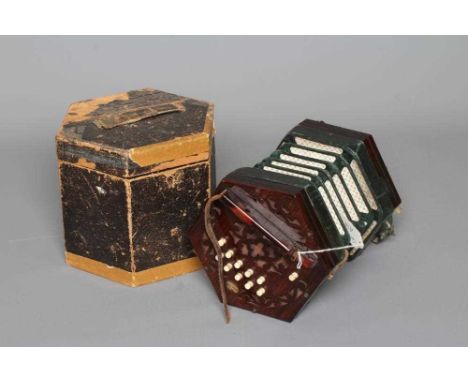 A LACHENAL AND CO. MAHOGANY CONCERTINA, 19th century, of hexagonal form with five fold leather bellows and fret carved ends, 