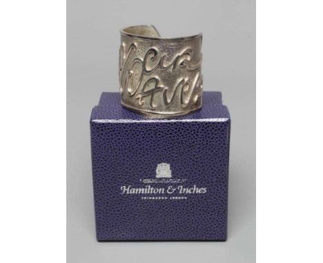 A MODERN WIDE SILVER CUFF by Hamilton & Inches, Edinburgh 2002, cast in low relief with 'Mon Coeur Avez', the Z inset with a 