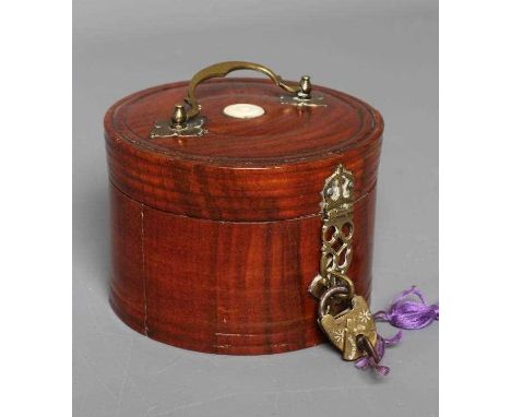 AN EDWARDIAN GENTLEMAN'S FRUITWOOD CYLINDRICAL DRESSING TABLE BOX with inlaid bone button, brass handle, hinge and latch, 3 3
