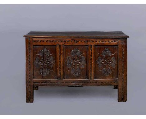 A JOINED OAK PANELLED CHEST, Yorkshire, Bradford/Halifax area, late 17th century, the hinged moulded edged plank lid opening 