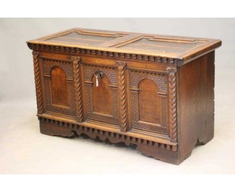 A NORTH EUROPEAN BOARDED CHEST, probably German 18th century, the hinged lid with moulded edged panels opening to a linen lin