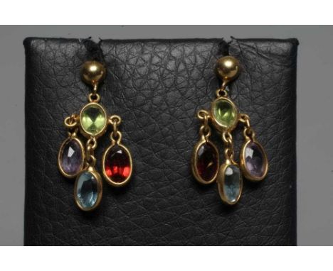 A PAIR OF MULTI-GEM CHANDELIER EARRINGS collet set with an oval facet cut aquamarine, peridot, garnet and amethyst hung from 