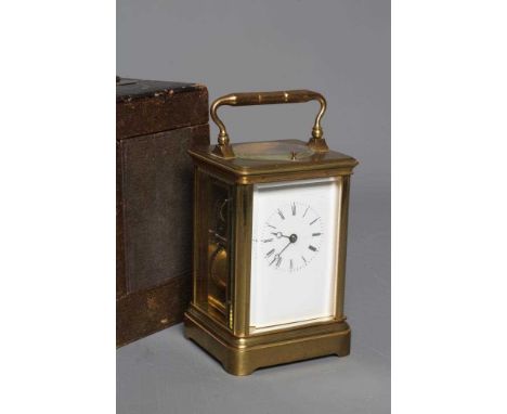 A BRASS CASED CARRIAGE CLOCK, the twin barrel movement with platform escapement striking on a bell, repeat action, the plain 