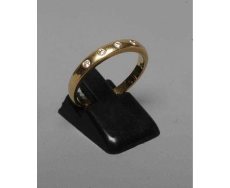 AN 18CT GOLD ETERNITY RING with five small brilliant cut diamonds in rub-over settings, Sheffield 2003, sponsor's mark PC, si