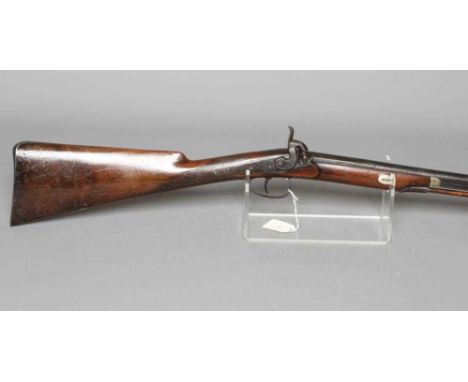 A PERCUSSION MUSKET, the 29 3/4" barrel octagonal at the breech, foliate etched action, steel trigger guard with pineapple fi