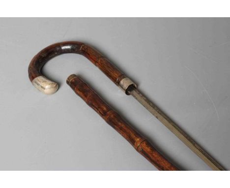A SILVER MOUNTED SWORD STICK, London 1925, with 27 1/4" fullered blade, faux bamboo crook handle, plated ferrule and bamboo s